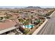 A neighborhood featuring single-story homes with pools, desert landscaping and mountain views in the distance at 1019 Amber Gate St, Henderson, NV 89002