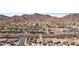 Aerial view of a neighborhood with houses, streets, and a mountain in the background at 1019 Amber Gate St, Henderson, NV 89002