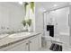 Renovated bathroom featuring a walk-in shower, granite countertop, and vanity mirror at 1019 Amber Gate St, Henderson, NV 89002