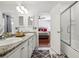 Bright bathroom with double sinks, granite countertops, and tile floors, offering a clean and functional space at 1019 Amber Gate St, Henderson, NV 89002
