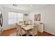 Bright dining area features a large window, modern decor, and seating for six guests at 1019 Amber Gate St, Henderson, NV 89002