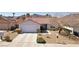 Inviting single-story home featuring a desert-landscaped front yard and a spacious two-car garage at 1019 Amber Gate St, Henderson, NV 89002