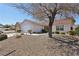 Charming single-story home featuring desert landscaping, a two-car garage, and a red tile roof at 1019 Amber Gate St, Henderson, NV 89002
