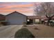 Charming single-story home featuring desert landscaping, a two-car garage, and a red tile roof at 1019 Amber Gate St, Henderson, NV 89002