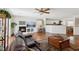 Inviting living room with hardwood floors, a cozy fireplace, and an open-concept design at 1019 Amber Gate St, Henderson, NV 89002