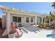 Covered patio with outdoor seating area, ceiling fan, and view of the backyard pool at 1019 Amber Gate St, Henderson, NV 89002