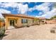 Picture of a low-maintenance backyard with a covered patio and mature landscaping at 10260 Hawks Wing St, Las Vegas, NV 89178