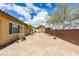 Spacious backyard showcasing low-maintenance desert landscaping and privacy wall at 10260 Hawks Wing St, Las Vegas, NV 89178