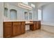 Bright bathroom featuring a double sink vanity, large mirror, and soaking tub at 10260 Hawks Wing St, Las Vegas, NV 89178