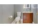 Contemporary powder room featuring a glass bowl sink and modern fixtures at 10260 Hawks Wing St, Las Vegas, NV 89178