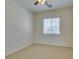 Bedroom with neutral carpet and bright, natural light from one window at 10260 Hawks Wing St, Las Vegas, NV 89178
