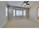 Bedroom featuring a bay window, carpet, and ceiling fan at 10260 Hawks Wing St, Las Vegas, NV 89178