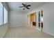 Spacious bedroom features carpet, ceiling fan and windows providing ample natural light at 10260 Hawks Wing St, Las Vegas, NV 89178