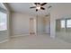 Bedroom with ensuite access, closet with mirrored door, carpet and ceiling fan at 10260 Hawks Wing St, Las Vegas, NV 89178