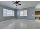 Living room offers marble floors and backyard views through bright windows at 10260 Hawks Wing St, Las Vegas, NV 89178