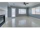 Spacious living room features a fireplace, marble floors, and backyard access at 10260 Hawks Wing St, Las Vegas, NV 89178