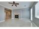 Bright living room with fireplace, neutral walls and tile flooring throughout at 10260 Hawks Wing St, Las Vegas, NV 89178