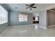 Open living room with tile floors and access to the kitchen at 10260 Hawks Wing St, Las Vegas, NV 89178