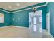Bright living room with marble floors, recessed lighting, and a stylish chandelier at 10260 Hawks Wing St, Las Vegas, NV 89178