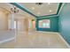 Living room view with open layout, travertine flooring, and archway design at 10260 Hawks Wing St, Las Vegas, NV 89178