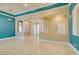 Living room with arched entryways and columns, featuring travertine floors at 10260 Hawks Wing St, Las Vegas, NV 89178
