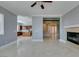 Bright and airy living room adjacent to the kitchen, with marble floors throughout at 10260 Hawks Wing St, Las Vegas, NV 89178