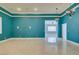 Open living space illuminated by an elegant chandelier with recessed lighting and bright walls at 10260 Hawks Wing St, Las Vegas, NV 89178