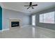 Inviting living room with fireplace and access to the outdoor space, with marble floors at 10260 Hawks Wing St, Las Vegas, NV 89178