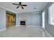 Open-concept living room featuring a fireplace and seamless flow to adjacent rooms at 10260 Hawks Wing St, Las Vegas, NV 89178