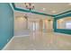 A bright, expansive living room with travertine flooring and architectural details at 10260 Hawks Wing St, Las Vegas, NV 89178