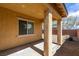Covered patio offers shade and a view of the low-maintenance backyard at 10260 Hawks Wing St, Las Vegas, NV 89178
