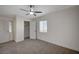 Bright bedroom featuring neutral paint, carpet flooring, ceiling fan and closet at 105 Ash St, Henderson, NV 89015