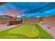 Picture-perfect backyard featuring an outdoor mini-golf area at 122 Cabaletta Ln, Henderson, NV 89015