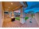 Relaxing backyard with a fire pit, mini-golf, hot tub, and pavers at 122 Cabaletta Ln, Henderson, NV 89015