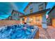 Inviting backyard with a luxurious hot tub and manicured landscaping at 122 Cabaletta Ln, Henderson, NV 89015