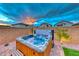 Inviting backyard with a luxurious hot tub and manicured landscaping at 122 Cabaletta Ln, Henderson, NV 89015