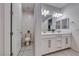 Modern bathroom featuring dual sinks, white cabinetry, and a separate toilet room at 122 Cabaletta Ln, Henderson, NV 89015