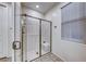 Modern bathroom with glass enclosed shower and tile flooring at 122 Cabaletta Ln, Henderson, NV 89015