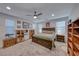 Large bedroom with ceiling fan, neutral carpet, and natural lighting at 122 Cabaletta Ln, Henderson, NV 89015