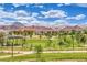 A community park features a gazebo, picnic tables, and paths, all set against a beautiful mountain backdrop at 122 Cabaletta Ln, Henderson, NV 89015