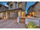 Beautiful two-story home with a paved driveway, landscaped yard, and a two-car garage at 122 Cabaletta Ln, Henderson, NV 89015