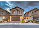 Charming two-story home with a brick driveway and well-manicured landscaping at 122 Cabaletta Ln, Henderson, NV 89015