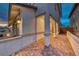 Exterior view of the home showing the entrance, paved walkway, and manicured landscaping at 122 Cabaletta Ln, Henderson, NV 89015