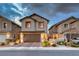 Beautiful two-story home with a paved driveway, manicured landscaping, and a two-car garage at 122 Cabaletta Ln, Henderson, NV 89015