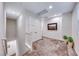Upstairs hallway with neutral carpet and natural light from window at 122 Cabaletta Ln, Henderson, NV 89015