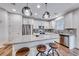 Bright kitchen with stainless steel appliances, granite countertops, and pendant lighting above the island at 122 Cabaletta Ln, Henderson, NV 89015