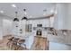 Stylish kitchen featuring granite countertops, stainless steel appliances, and a convenient center island at 122 Cabaletta Ln, Henderson, NV 89015