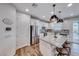 Bright kitchen featuring stainless steel appliances, granite countertops, and a stylish island with bar seating at 122 Cabaletta Ln, Henderson, NV 89015