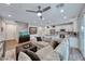 Open-concept living area connecting to the kitchen, featuring a cozy sectional sofa and modern decor at 122 Cabaletta Ln, Henderson, NV 89015