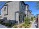Townhome exterior with landscaping and walkway leading to entrance at 12728 Feathersong St, Henderson, NV 89044